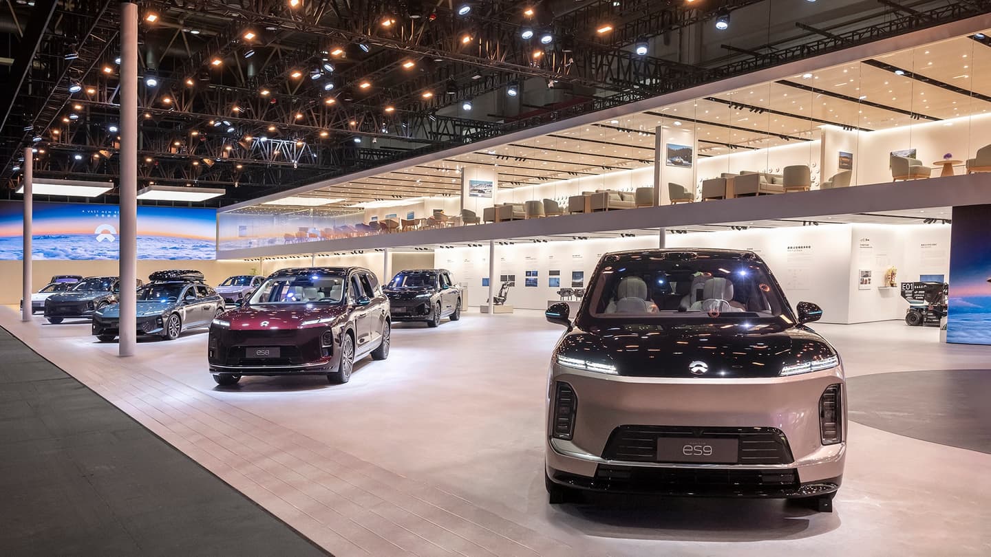 Illustration for the article "Nio puts three brands on one stage at Auto China 2026: ES9 debut, ES8 Mirrorblack pricing and a Silk Road battery-swap plan" from NIO